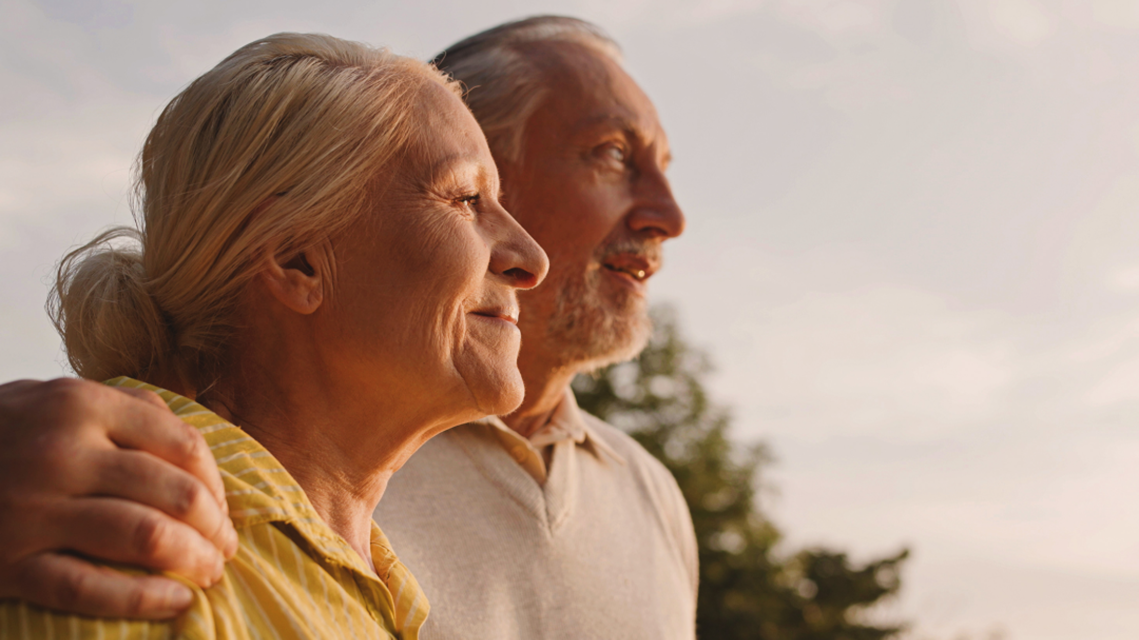 Older couple looking into the distance together