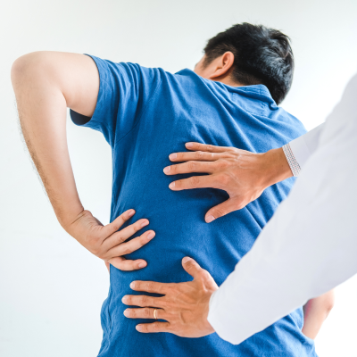 Person receiving back massage from a healthcare professional